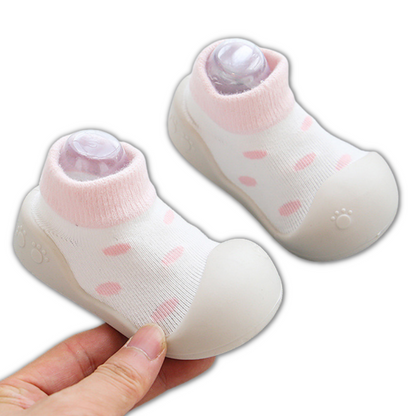 Multicolor baby soft sole shoes with non-slip grip, providing stability for early walking stages.