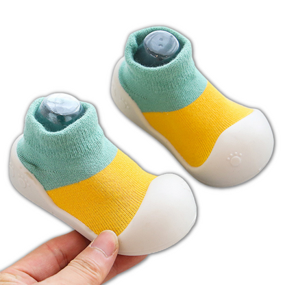 Close-up texture of soft cotton non-slip baby shoes, ensuring comfort and safety for first steps.