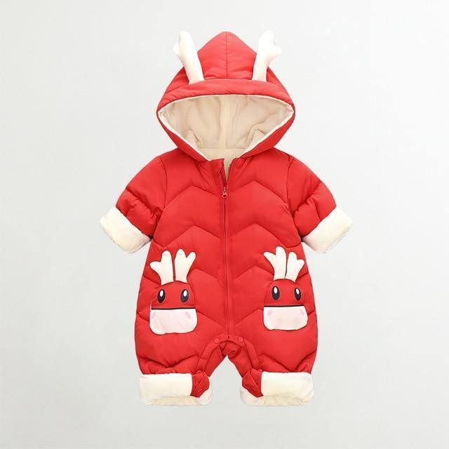 Happy baby in a cozy padded reindeer onesie, ready for winter play and holiday cheer.