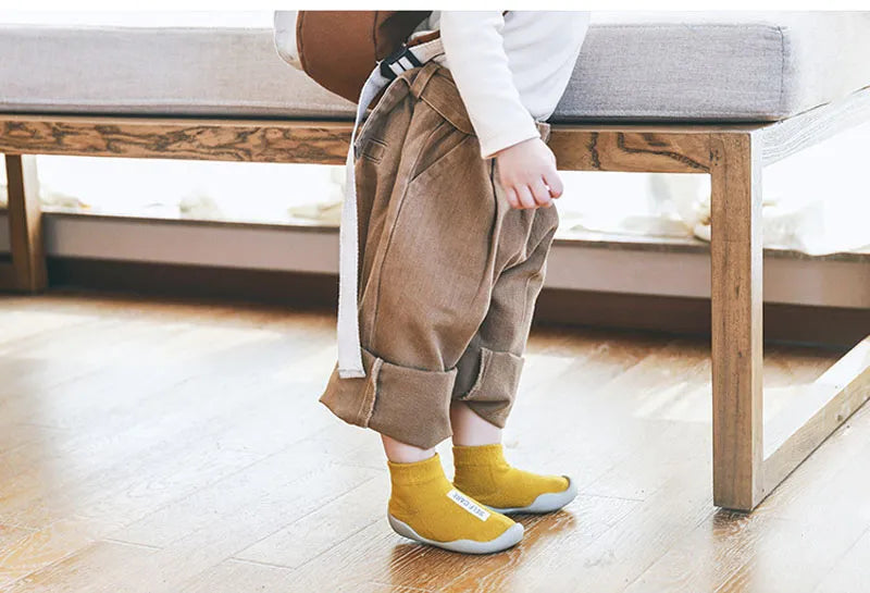 High-quality knit infant shoes with non-slip flexible soles, a must-have for active toddlers.
