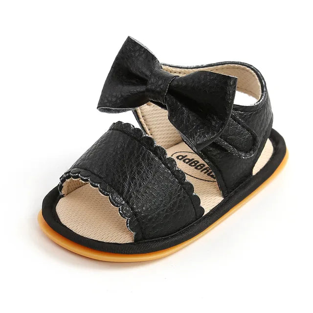 Little feet wearing soft sole toddler sandals, ready for comfortable outdoor play.