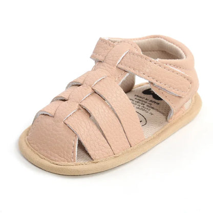 Breathable baby summer footwear with an adjustable strap for a snug fit.