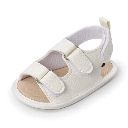 Baby girl's soft grip sandals in a lovely pastel color, ideal for summer outfits.