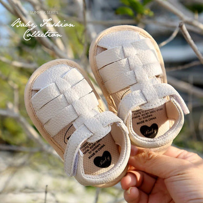 Pair of baby first walker sandals with breathable design, ideal for warm weather outdoor play.