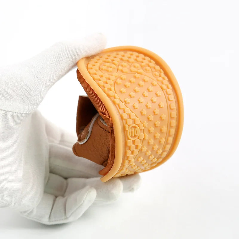 Baby sandals showcasing a flexible soft sole, ensuring comfort for little feet.