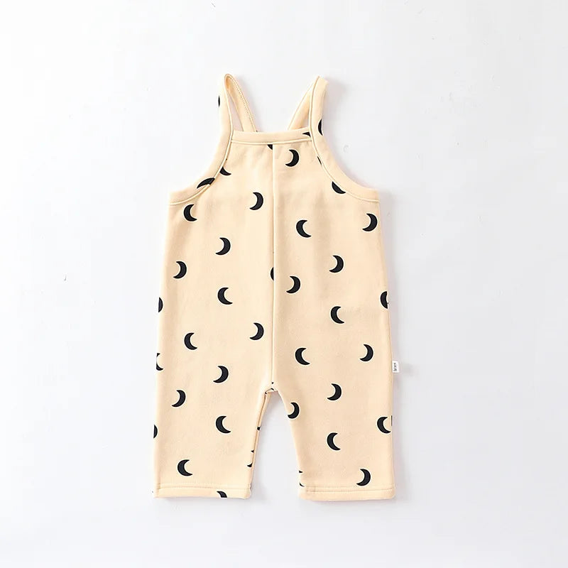Soft green cotton toddler overalls paired with a simple tee, great for everyday wear.