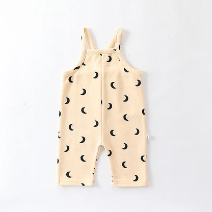 Soft green cotton toddler overalls paired with a simple tee, great for everyday wear.