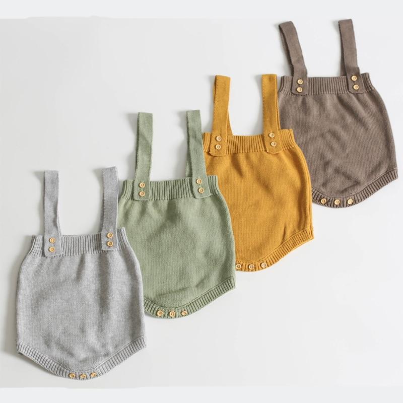 Full shot of a warm wool romper for babies, featuring charming handmade details.