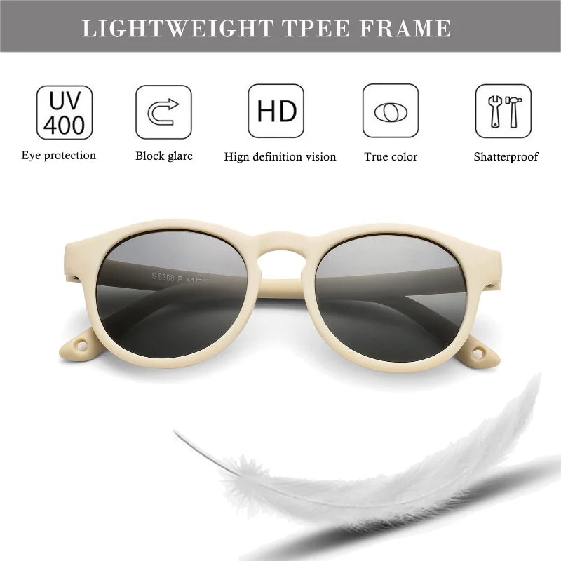 Side view of black baby polarized UV400 sunglasses, highlighting round frame and infant UV protection.