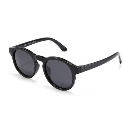 Group of colorful baby polarized UV400 sunglasses in pink, blue, yellow, and green on a white background.