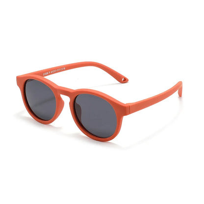 Detail of the polarized lens of baby UV400 sunglasses, emphasizing infant eye protection from harmful rays.