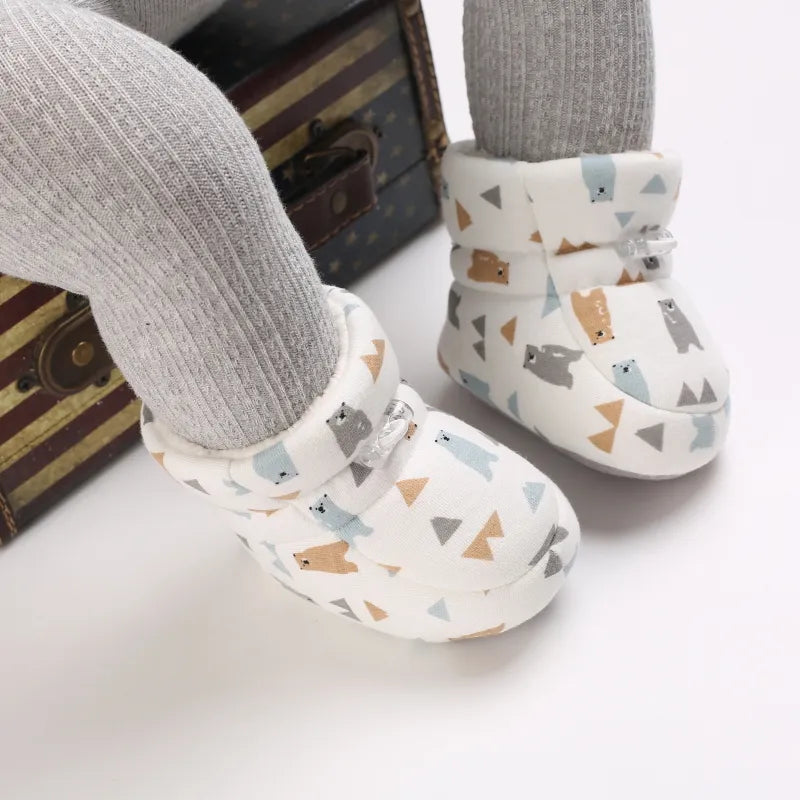 Adorable baby winter animal slippers with non-slip soft sole for infants and toddlers, keeping feet warm.