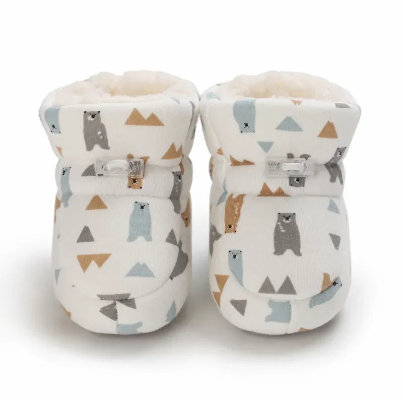 Soft-sole baby animal slippers, non-slip winter footwear, providing warmth and safety for toddlers.