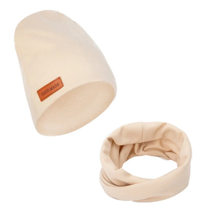 Side view of a baby winter hat and matching scarf set, polyester cotton blend for warmth
