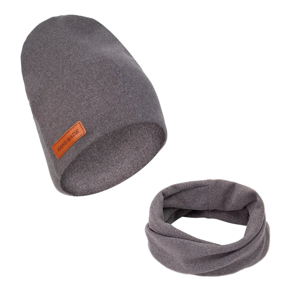 Top-down view of a baby winter hat and scarf set, neatly arranged, unisex infant wear