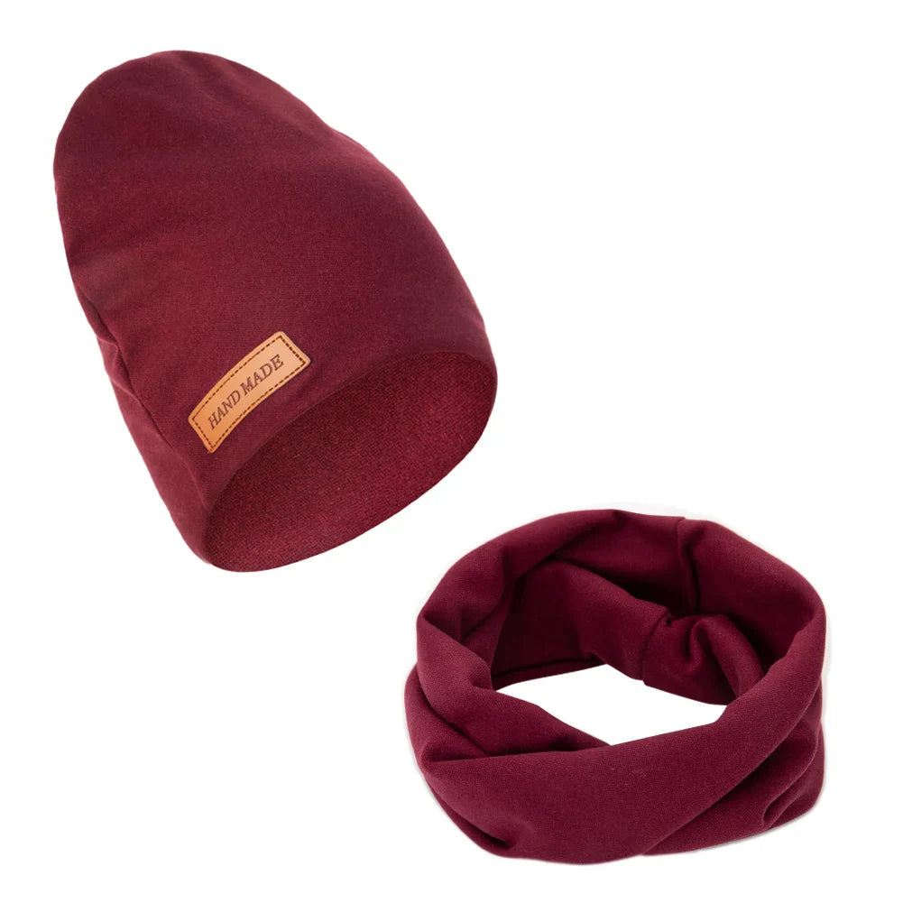 Young infant wearing a snug baby winter hat and scarf set, ensuring cozy warmth
