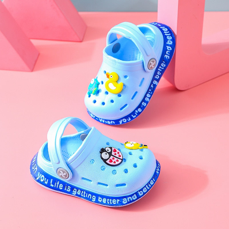 Toddler's feet in red cartoon EVA sandals, showcasing comfortable and secure non-slip fit