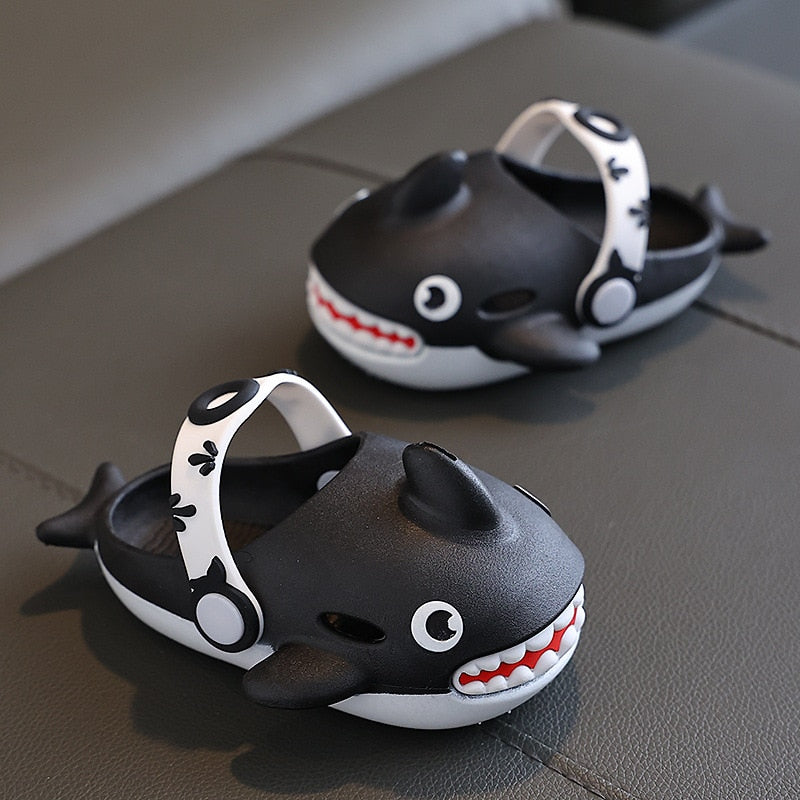 Playful pink cartoon shark slippers for girls, designed for all-weather comfort and durability.