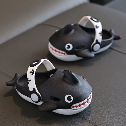 Playful pink cartoon shark slippers for girls, designed for all-weather comfort and durability.