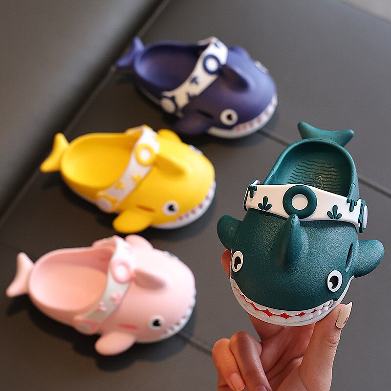 Pink shark-themed slippers for kids, lightweight and breathable for all-day wear.
