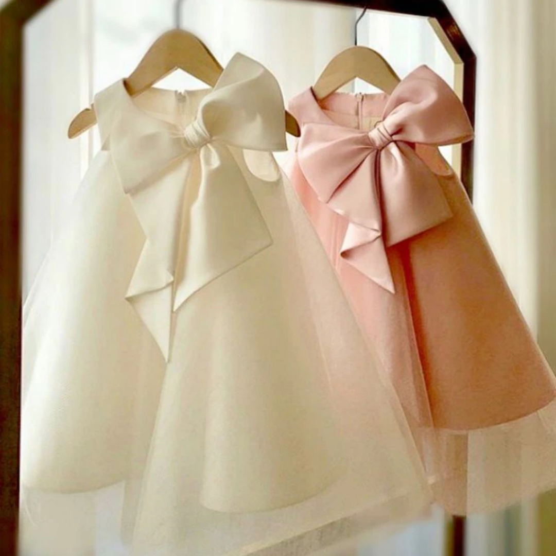 Chic girls' special occasion dress with a big bow detail, sleeveless for comfort and style.