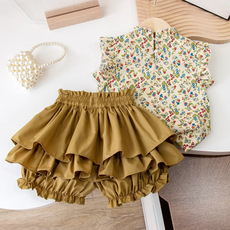 Two-piece girls' summer set featuring vibrant floral top and matching skirt, comfortable kidsfashion.