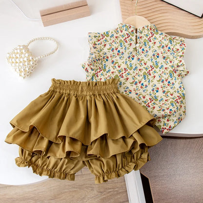 Two-piece girls' summer set featuring vibrant floral top and matching skirt, comfortable kidsfashion.