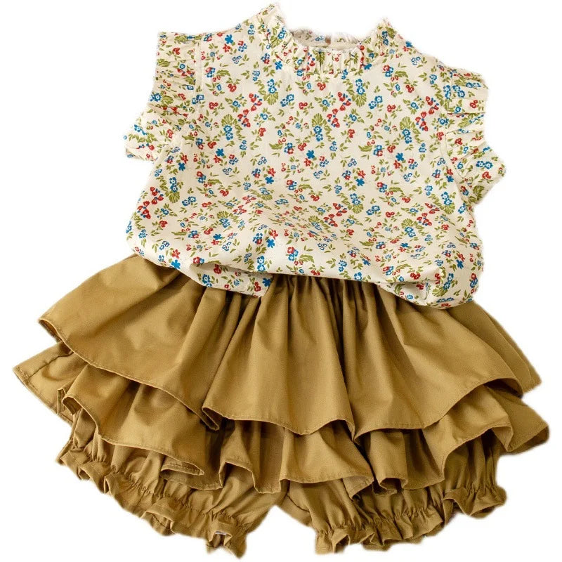 Girls' summer outfit: a comfortable floral print top paired with a coordinating skirt for toddlers.