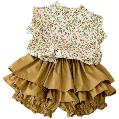 Girls' summer outfit: a comfortable floral print top paired with a coordinating skirt for toddlers.