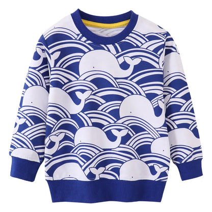 Close-up of the whale print on a girls' long sleeve cotton dress, showcasing the cute design
