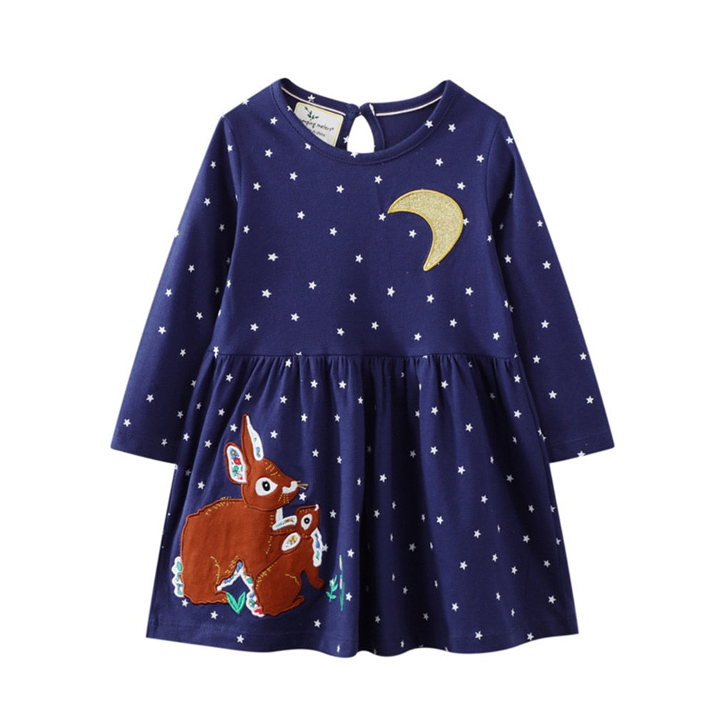 Toddler's adorable long sleeve cotton dress featuring delightful embroidery and playful patch designs.