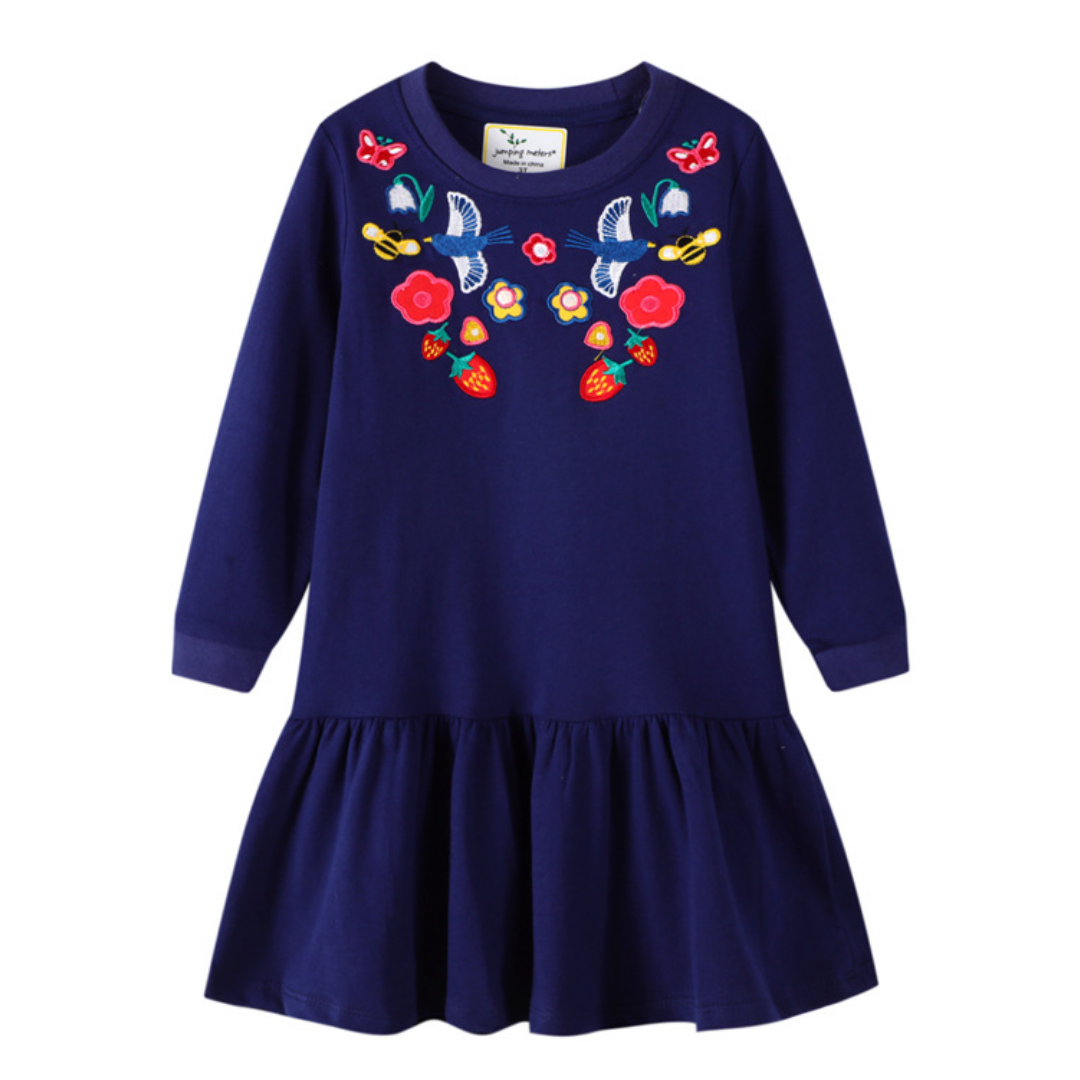Cute toddler girls' knee-length dress featuring vibrant embroidery patches on soft long sleeves.
