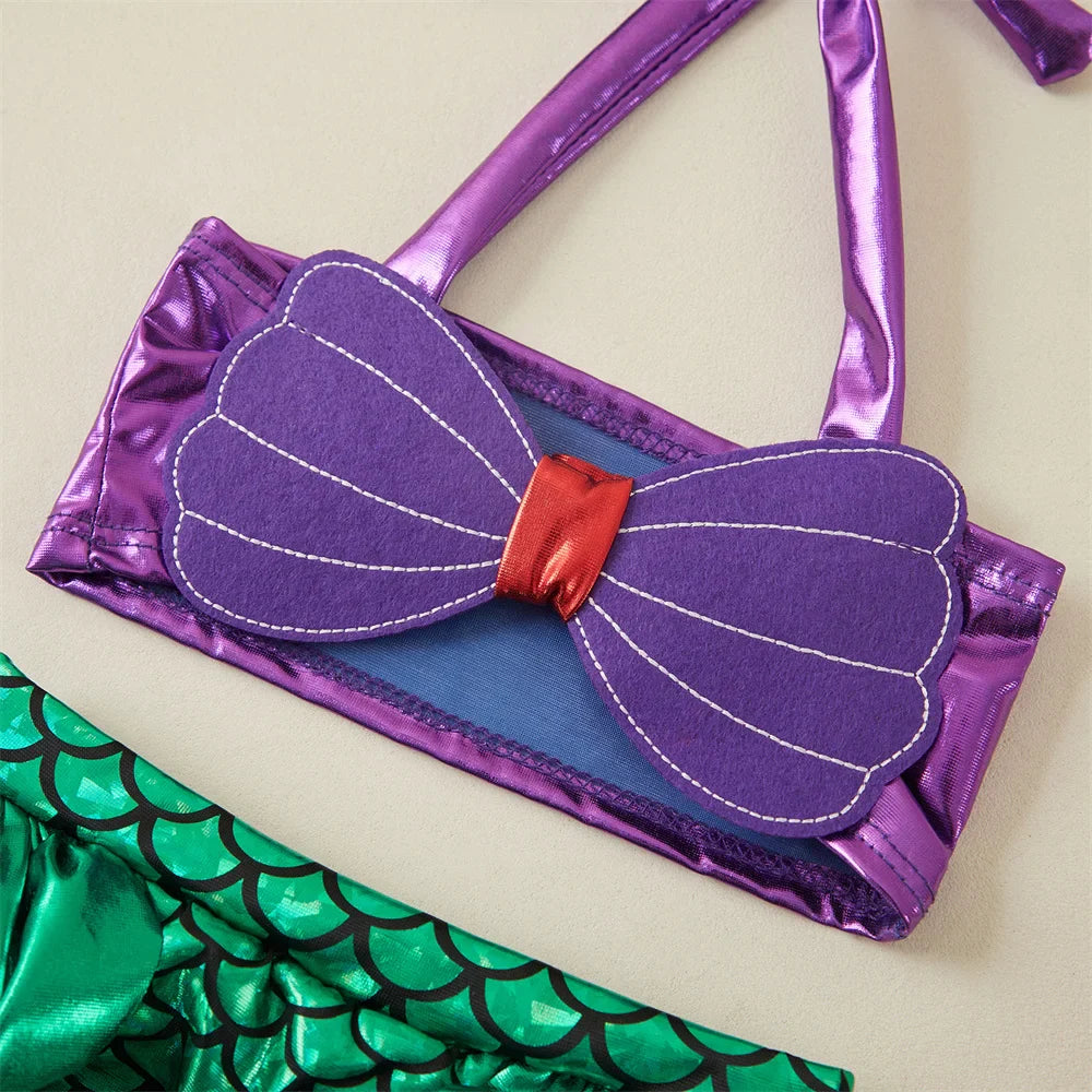 Girls' adorable two-piece mermaid swimsuit with a vibrant scale pattern and a sweet bow headband, toddler size