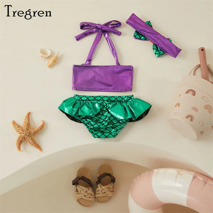 Toddler girl's mermaid swimwear set, vibrant colors, scallop top, matching scale print bottom and headband