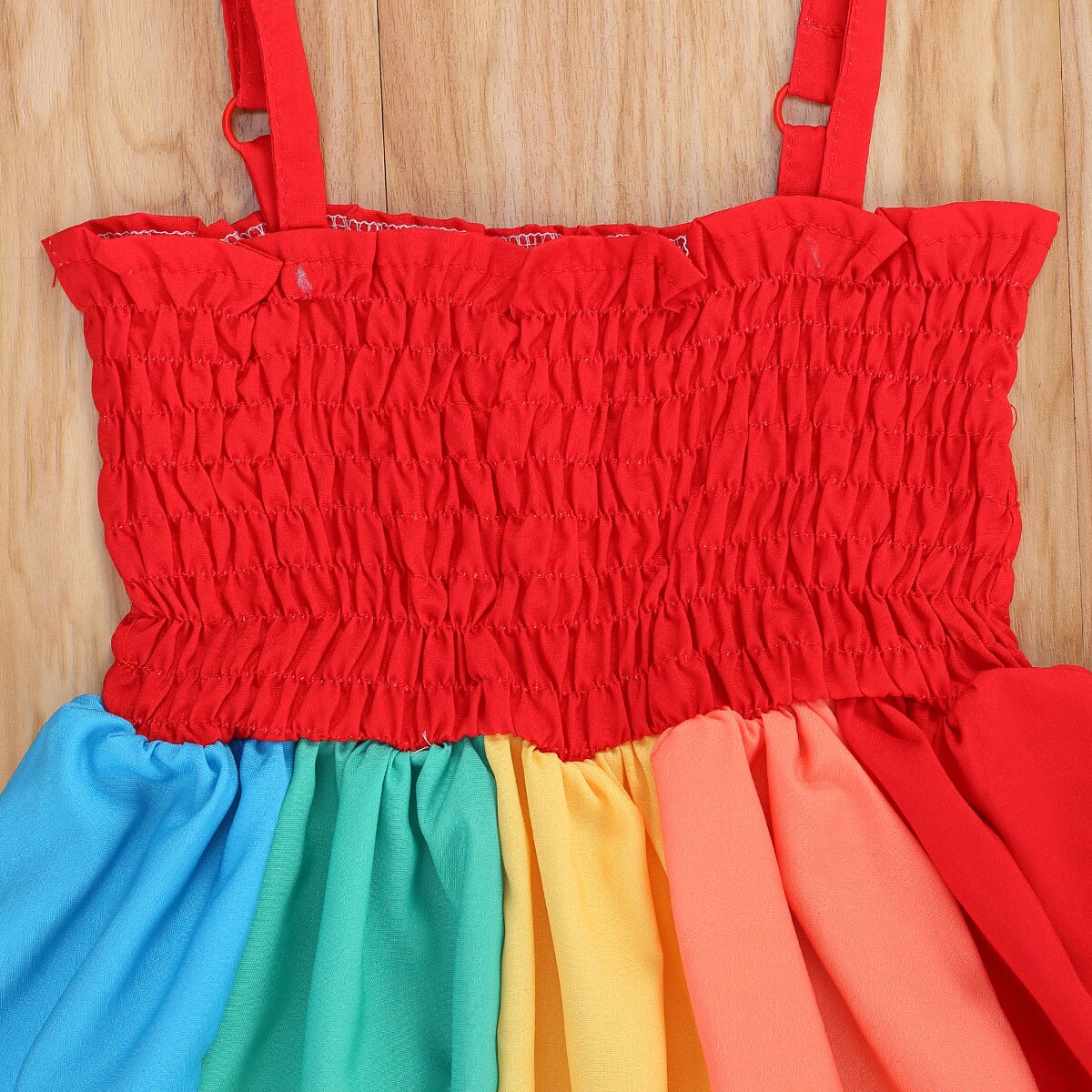 Toddler girl in a vibrant rainbow strap summer dress, ideal for sunny days and children's apparel, adjustable