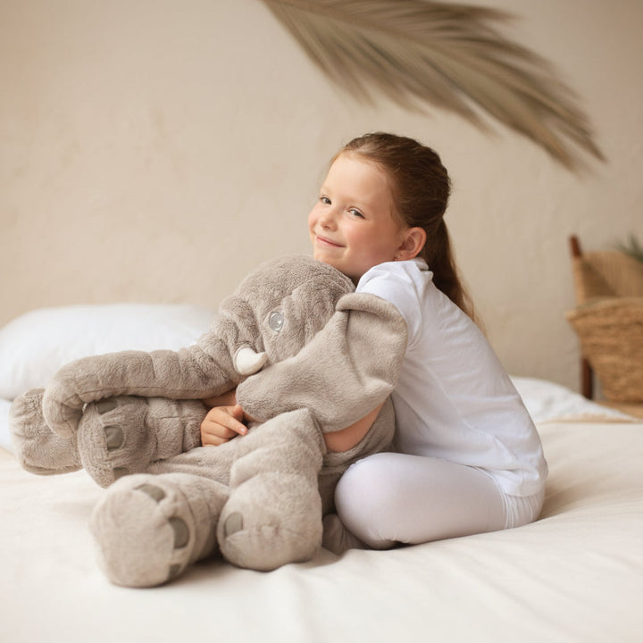 Soft grey elephant plushie, a perfect kids gift. This adorable stuffed animal doubles as a comfy cuddle pillow.