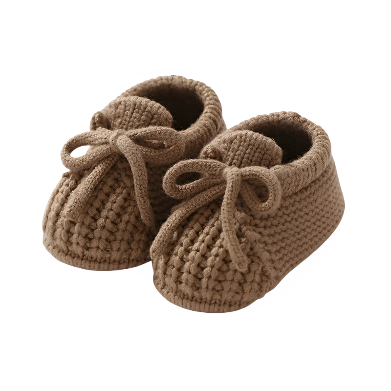 Comfortable gray knitted infant booties, soft sole shoes for a cozy baby first outfit.
