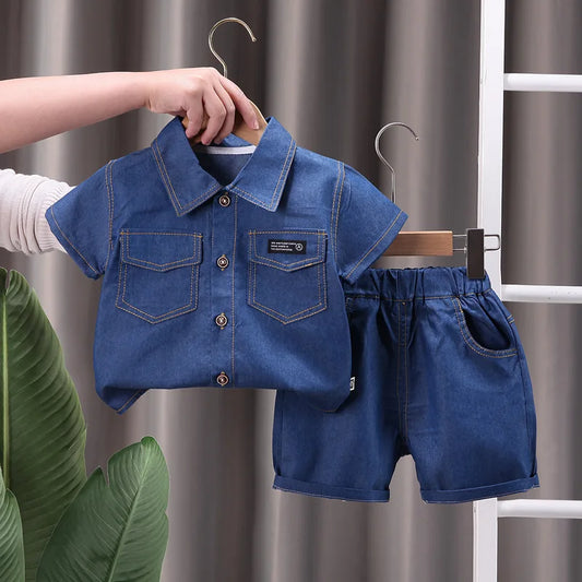 Adorable kids' denim shorts and short-sleeve shirt set for summer play, made from cotton spandex.