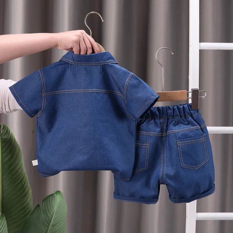 Unisex children's summer denim outfit, perfect for toddlers, featuring a comfortable cotton blend.
