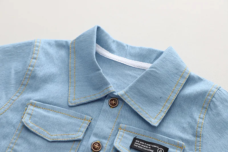 Playful kids' summer fashion: blue denim short set with soft cotton spandex for active children.