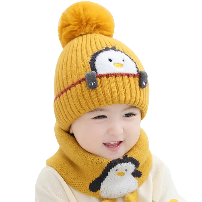 Childrenswear winter accessory set: knit hat with playful penguin face and matching scarf