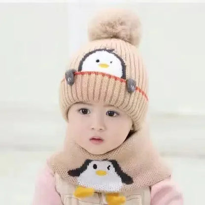 Soft knit penguin-themed winter hat with ear flaps and matching warm scarf for children