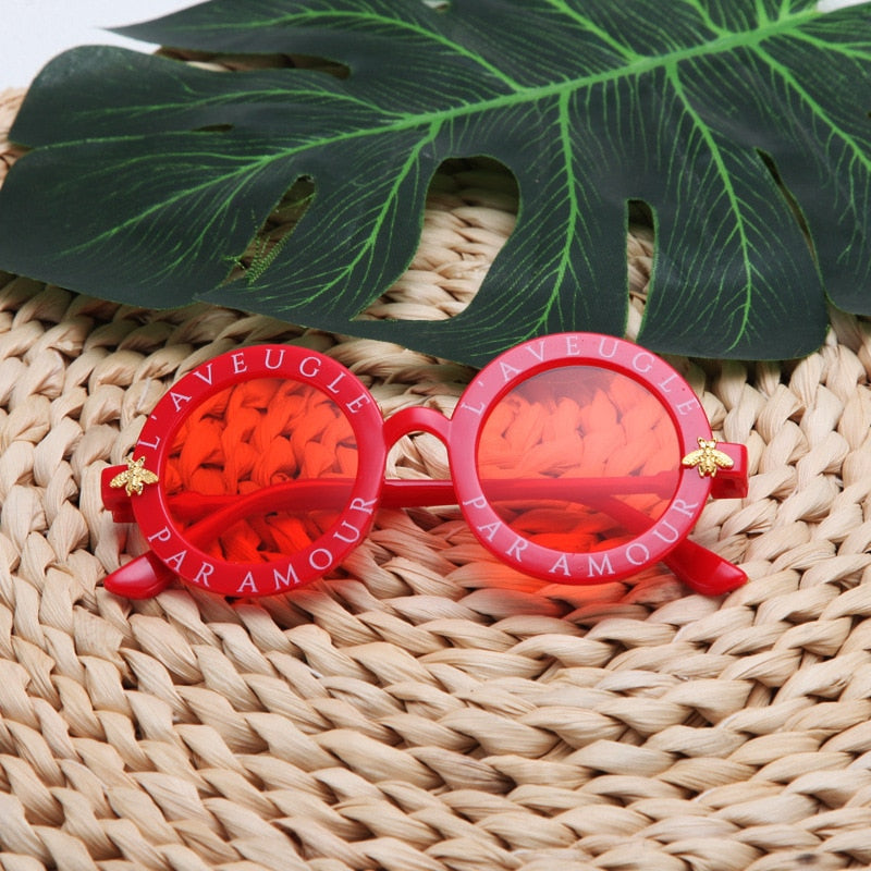 Unisex kids' round frame UV protection sunglasses, perfect everyday eyewear for children.