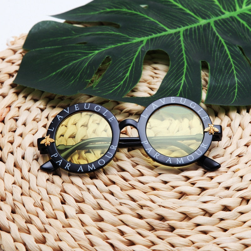 Fashionable kids' yellow round frame UV protection sunglasses for outdoor play and baby accessories.