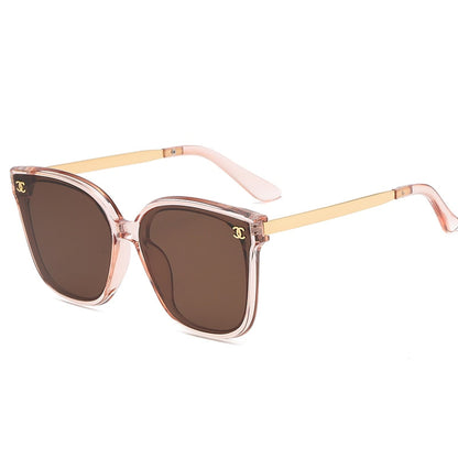 Child's white round frame sunglasses with UV protection, a trendy accessory for sunny outings.