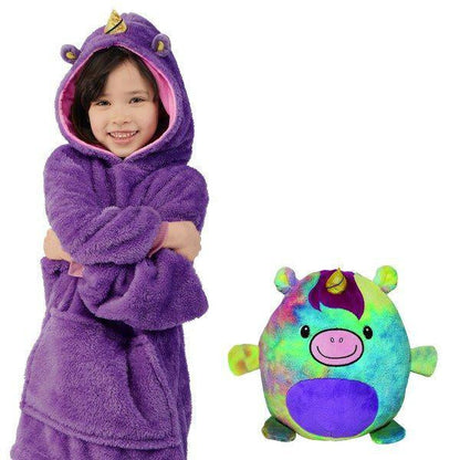 Full view of a child wrapped in a plush animal blanket, functioning as both clothing and toy