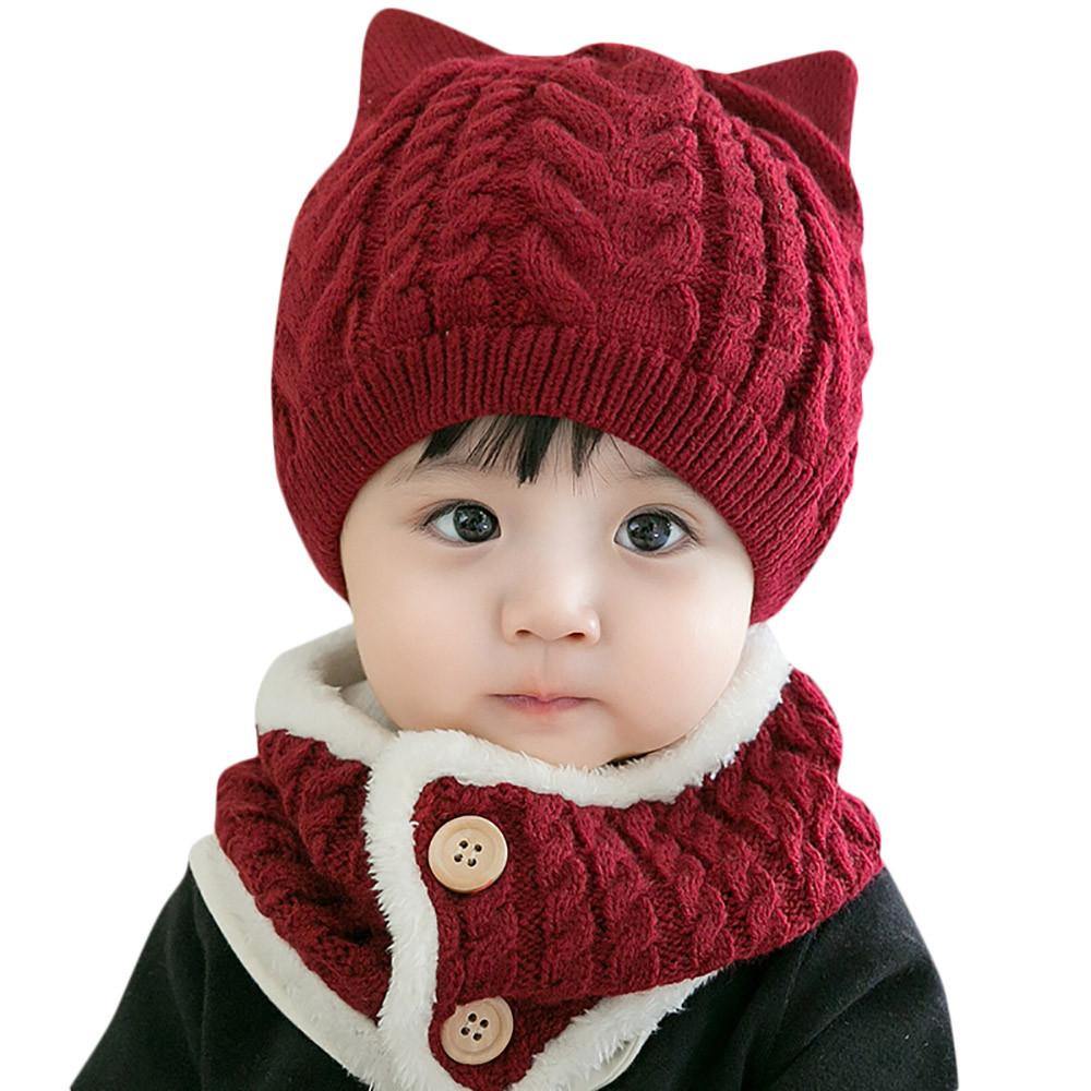 Infant's 'cute cat' knitted hat and scarf set, a warm baby essential for cold weather.