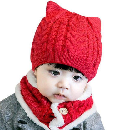 Baby accessories: a knitted cat design hat and scarf set in a vibrant red, for winter warmth.