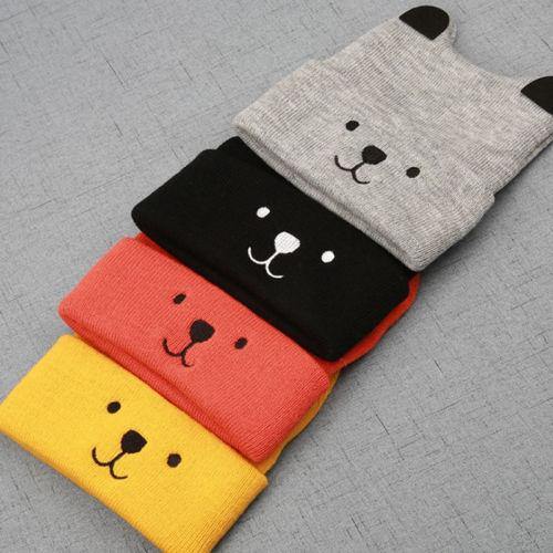 Toddler wearing a unisex knitted bear cub hat, cheerful and warm, a perfect baby accessory.