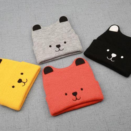 Front view of a charming knitted bear cub hat, an essential cute winter hat for kids.